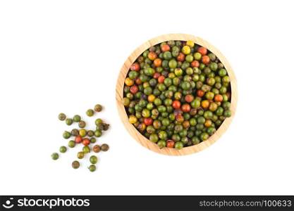 top view of fresh peppercorns in wooden bowl on white background