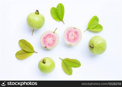 Top view of fresh ripe guava and slices with leaves.