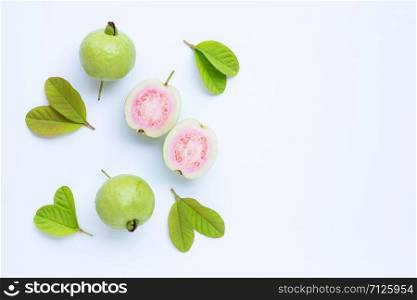 Top view of fresh ripe guava and slices with leaves.