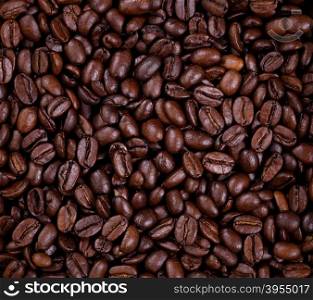 Top view of freshly roasted coffee beans in filled frame format.
