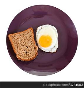 top view of fried egg and toasted rye bread on plate isolated on white background