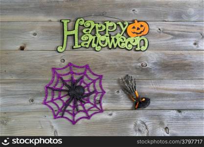 Top view of Halloween objects on rustic wood