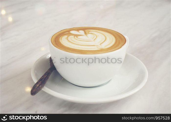 Top view of hot coffee latte with latte art