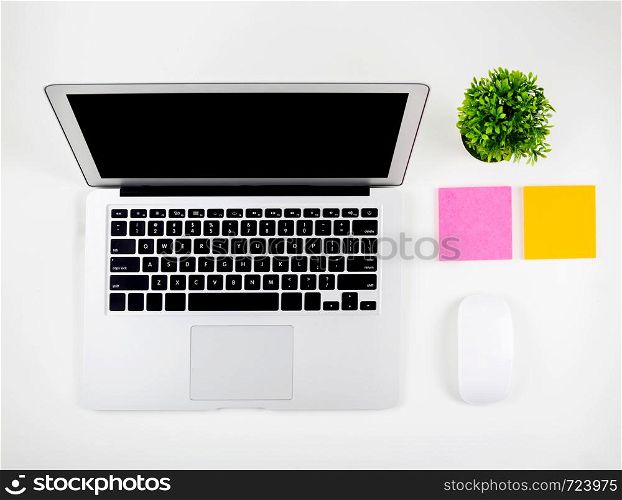 Top view of laptop computer with open display screen monitor, mouse and notepad isolated on white background, notebook or netbook with keyboard, communication technology concept.