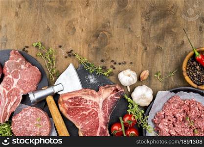top view of meat with garlic and herbs. Resolution and high quality beautiful photo. top view of meat with garlic and herbs. High quality and resolution beautiful photo concept