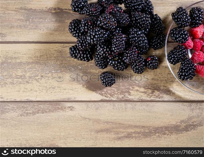 Top view of mixed fruits. Raspberries and blackberries. Mixed fresh fruits raspberries and blackberries
