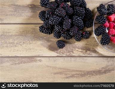 Top view of mixed fruits. Raspberries and blackberries. Mixed fresh fruits raspberries and blackberries