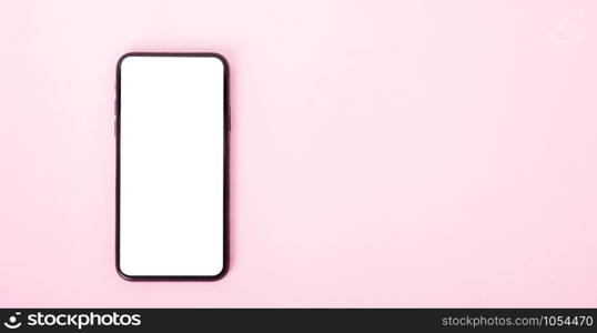 Top view of modern technology smart phone mobile on pink background with copy space