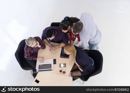 top view of multi ethnic startup business people group on brainstorming meeting in modern bright office interior