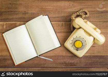 Top view of Notebook andOld telephone,Retro,vintage telephone