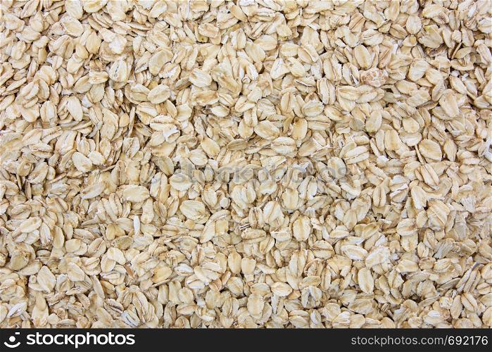Top view of oatmeal flakes in close-up as a background or full frame texture (high details)