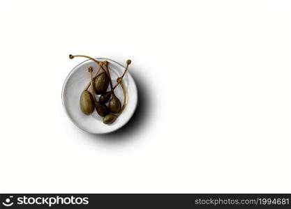 Top view of olive fruits on white plate isolated. fit for your design element.