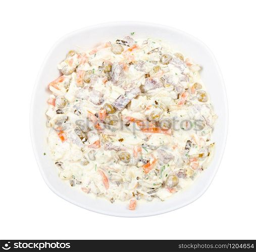 top view of portion of russian Olivier salad in white bowl isolated on white background. top view of portion of russian Olivier salad