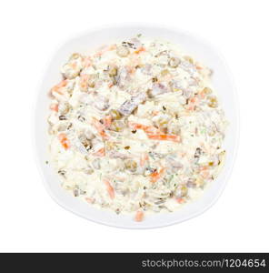 top view of portion of russian Olivier salad in white bowl isolated on white background. top view of portion of russian Olivier salad