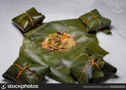 Top View of raw ingredients of the Nicaraguan nacatamal on banana leaves. Raw ingredients for the preparation of the traditional Nacatamal, Nacatamal ingredients on banana leaves