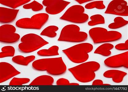 Top View of Scattered Hearts on White Background. Valentine?s Day Theme. Symbol of Love and Friendship