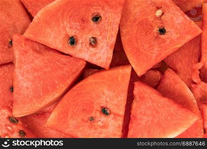 Top view of sliced red watermelon as a background