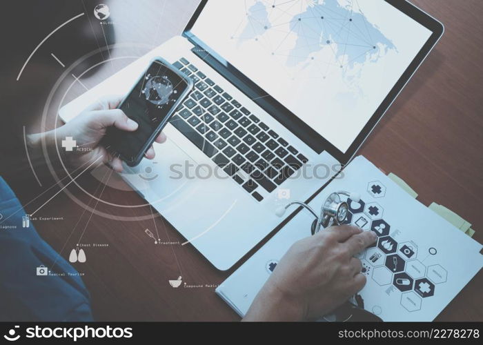 top view of smart medical doctor working with mobile phone and stethoscope and laptop computer on dark wooden desk with Vr diagram