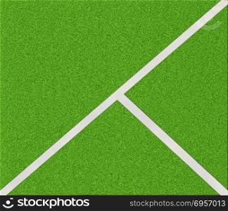 Top view of soccer field. White stripes on the green soccer field from top view