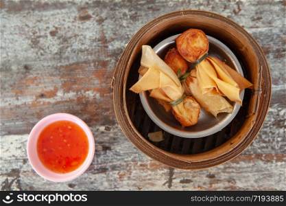 Top view of Thai Money Bag or Toong Tong is Thai Traditional Spring Rolls one of menu in Dim Sum Restaurant