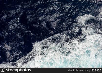 top view of the ocean with large waves from the ship. sea background. top view of the ocean with large waves from the ship. sea background.