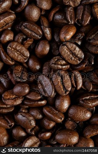Top view of the texture of roasted ready-to-drink coffee. Scene of coffee beans. Black ground coffee