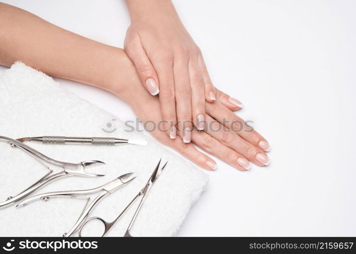 Top view of Tools of a manicure set on a white background.. Top view of Tools of a manicure set on a white background