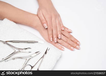 Top view of Tools of a manicure set on a white background.. Top view of Tools of a manicure set on a white background