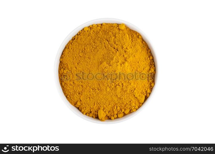 top view of turmeric powder in white ceramic bowl isolated on white background with clipping path