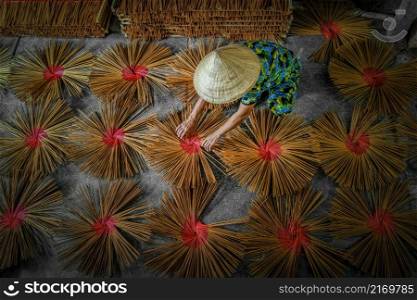 Top view of vietnamese working with red incense in house at long xuyen, an giang province, vietnam,traditional and culture concept