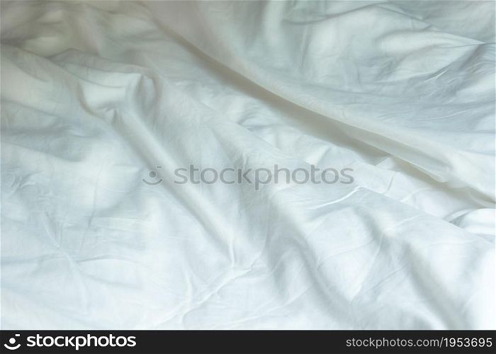 Top View Of White Wrinkle Messy Blanket On Bed, From Sleeping In A Long Night Winter.