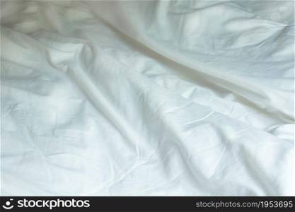 Top View Of White Wrinkle Messy Blanket On Bed, From Sleeping In A Long Night Winter.