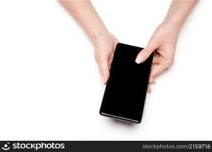 Top view of woman holding smartphone isolated on white background.. Top view of woman holding smartphone isolated on white background