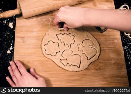 Top view of woman’s hands making traditional gingerbread. Top view of woman’s hands making gingerbread