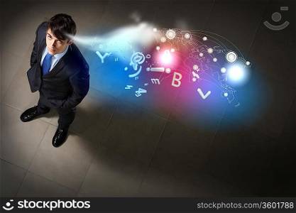 Top view of young businessman making decision