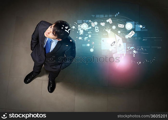 Top view of young businessman making decision