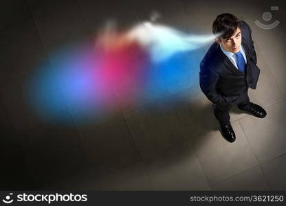 Top view of young businessman making decision