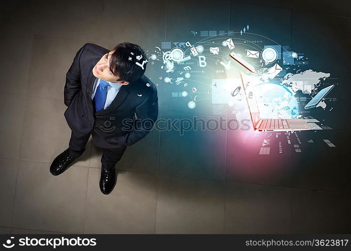 Top view of young businessman making decision