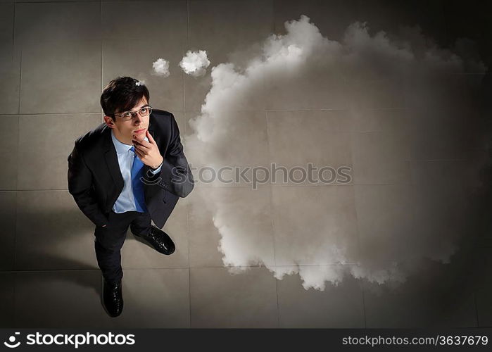 Top view of young businessman making decision