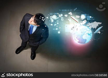 Top view of young businessman making decision