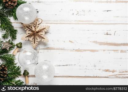 Top view of zero waste glass and wooden handmade Christmas decorations on white wooden background. Copy space. Top view of zero waste Christmas decorations