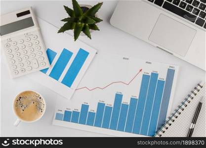 top view office desk with growth chart coffee cup. Resolution and high quality beautiful photo. top view office desk with growth chart coffee cup. High quality beautiful photo concept