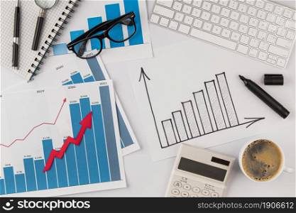 top view office desk with growth chart glasses. High resolution photo. top view office desk with growth chart glasses. High quality photo