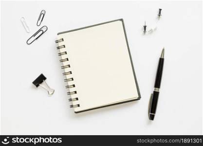 top view office stationery with notebook paper pins. Resolution and high quality beautiful photo. top view office stationery with notebook paper pins. High quality and resolution beautiful photo concept
