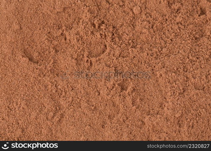 Top view on cocoa powder closeup background