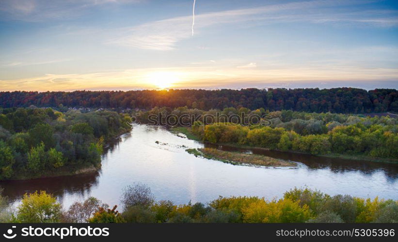 top view on field, trees and river