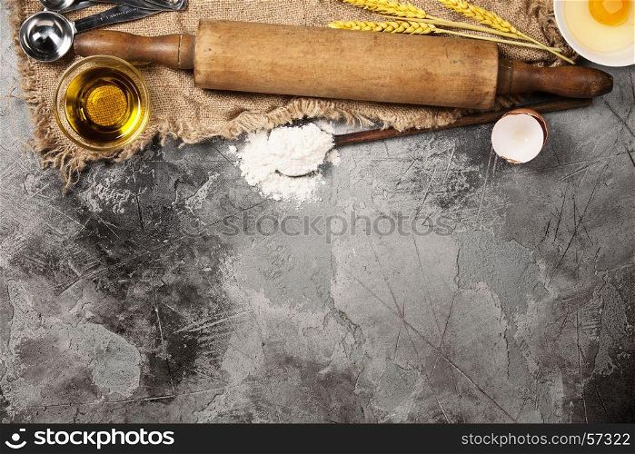 Top view on Old Kitchen cooking utensils on grey stone table - cooking concept