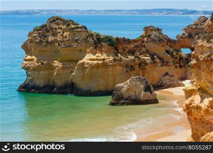 Top view on sandy beach Dos Tres Irmaos (Portimao, Alvor, Algarve, Portugal).