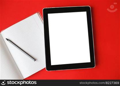 Top view open notepad and a gadget with mock up on a red background.. Top view open notepad and a gadget with mock up on red background.