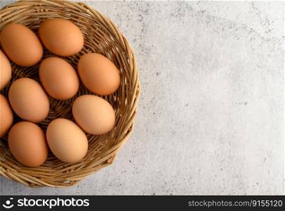 Top view organic brown eggs several in a wicker basket, preparing preparing for cooking food or dessert, copy space